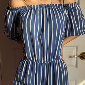 Striped white and blue jumper.